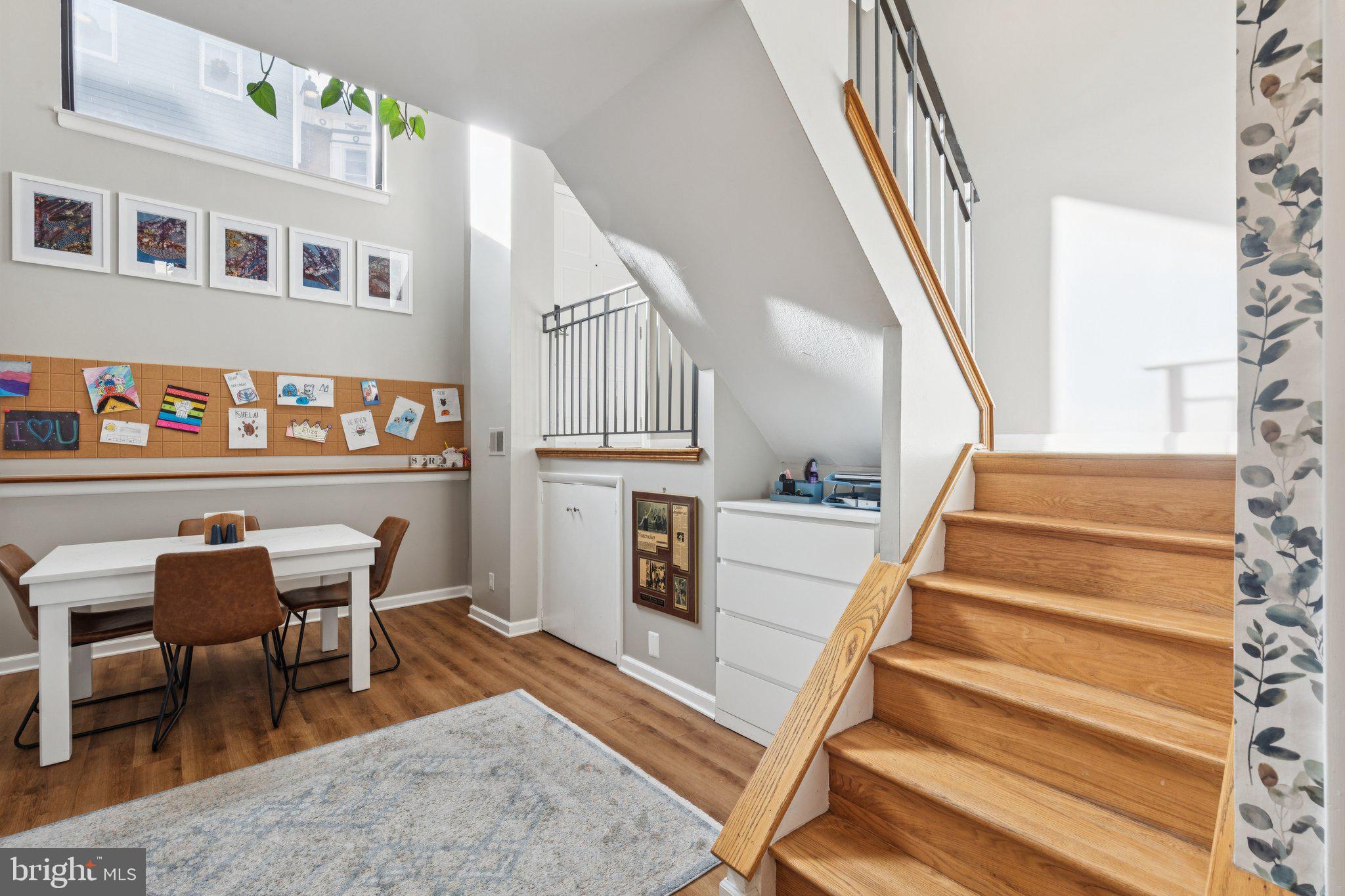 429 Gaskill Street Philadelphia, PA 19147 - Photo 12 of 63 a view of a hallway with wooden floor and dining room