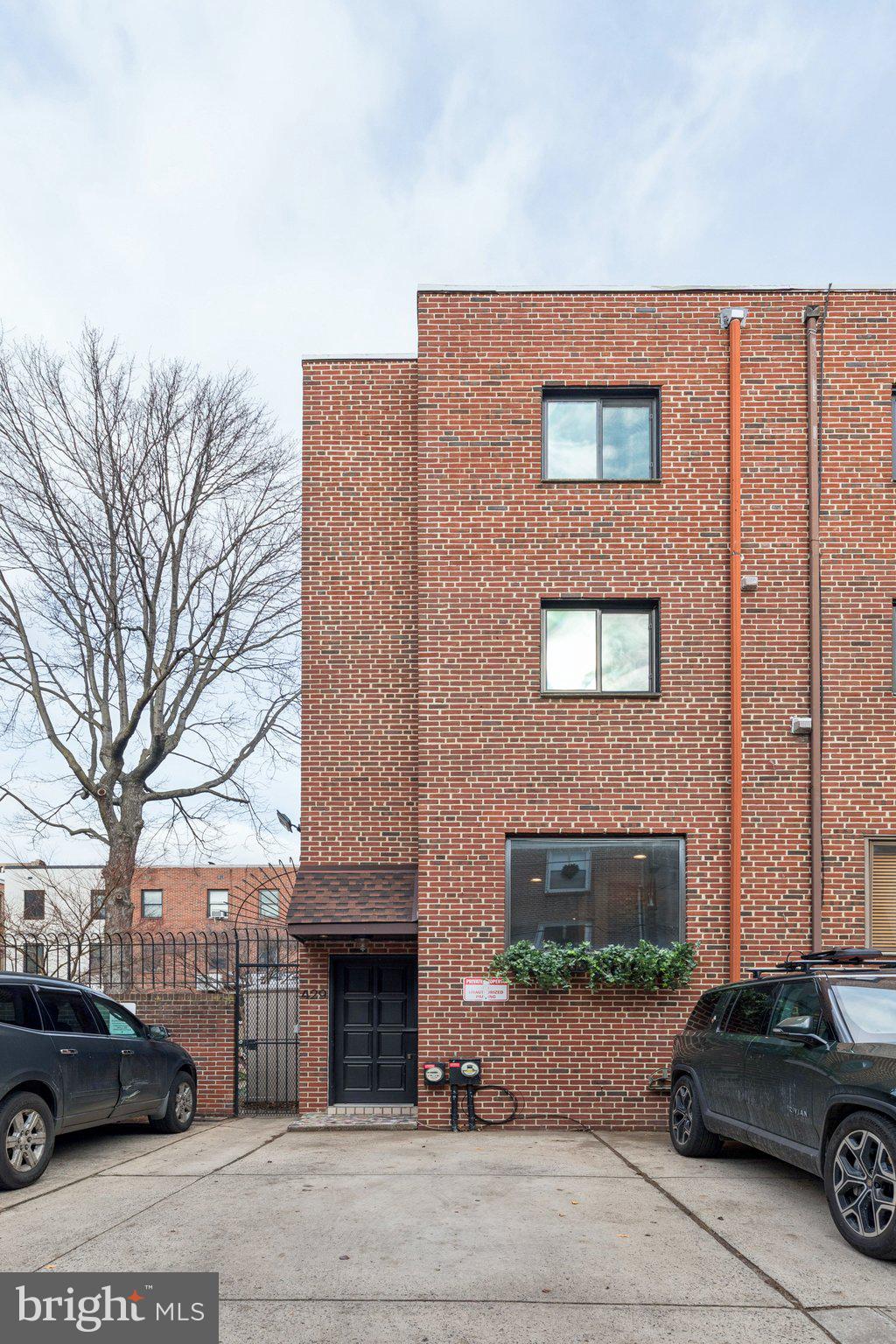429 Gaskill Street Philadelphia, PA 19147 - Photo 2 of 63 a front view of a building with parking space and a car parked