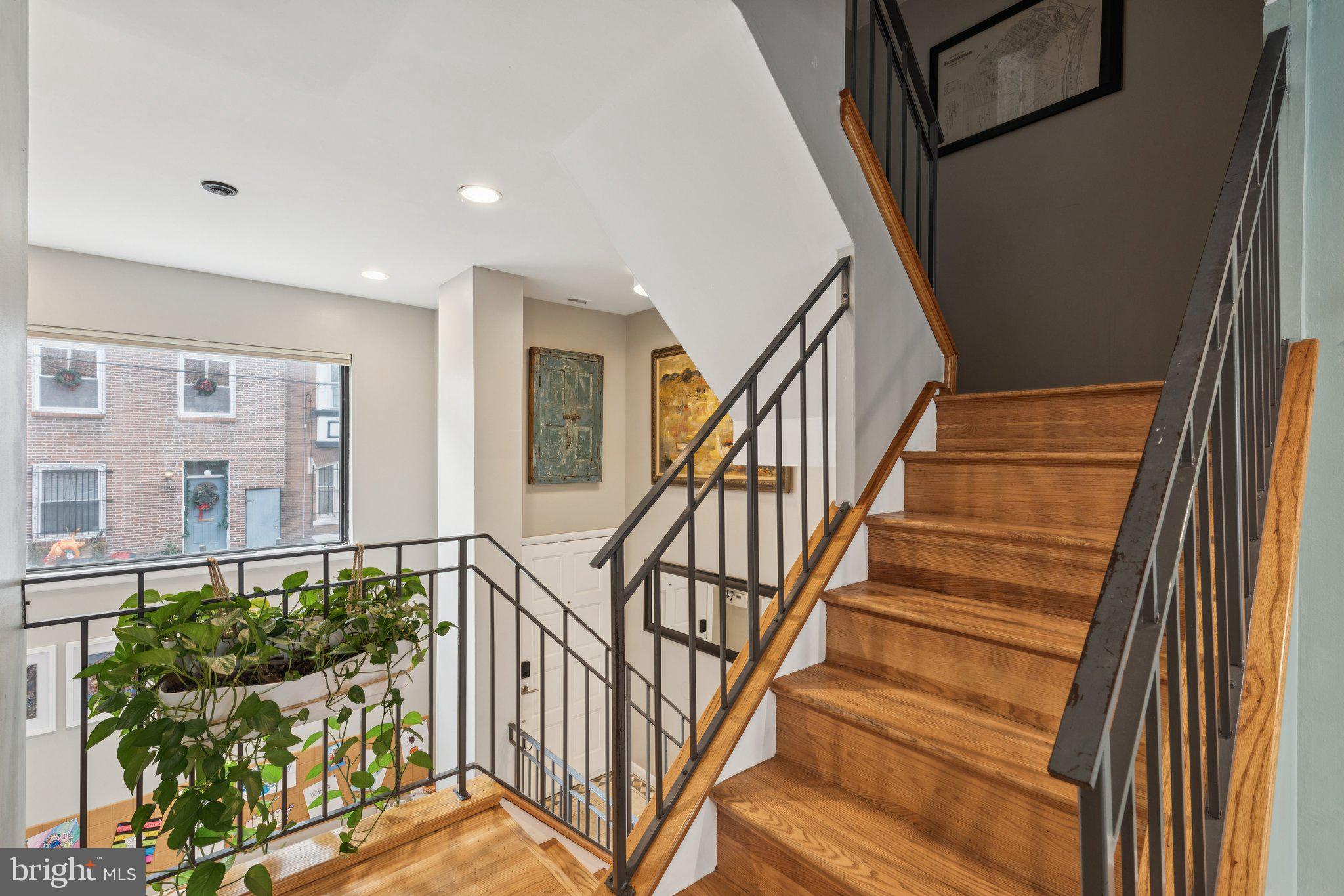 429 Gaskill Street Philadelphia, PA 19147 - Photo 26 of 63 a view of entryway and hall with wooden floor