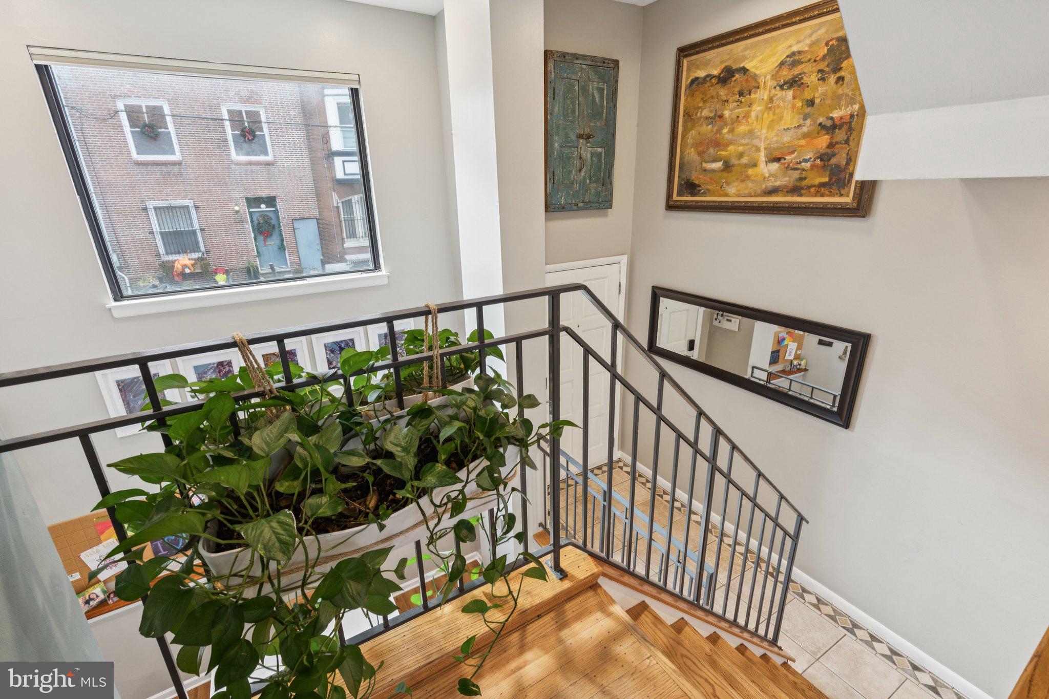 429 Gaskill Street Philadelphia, PA 19147 - Photo 27 of 63 a view of staircase with wooden floor