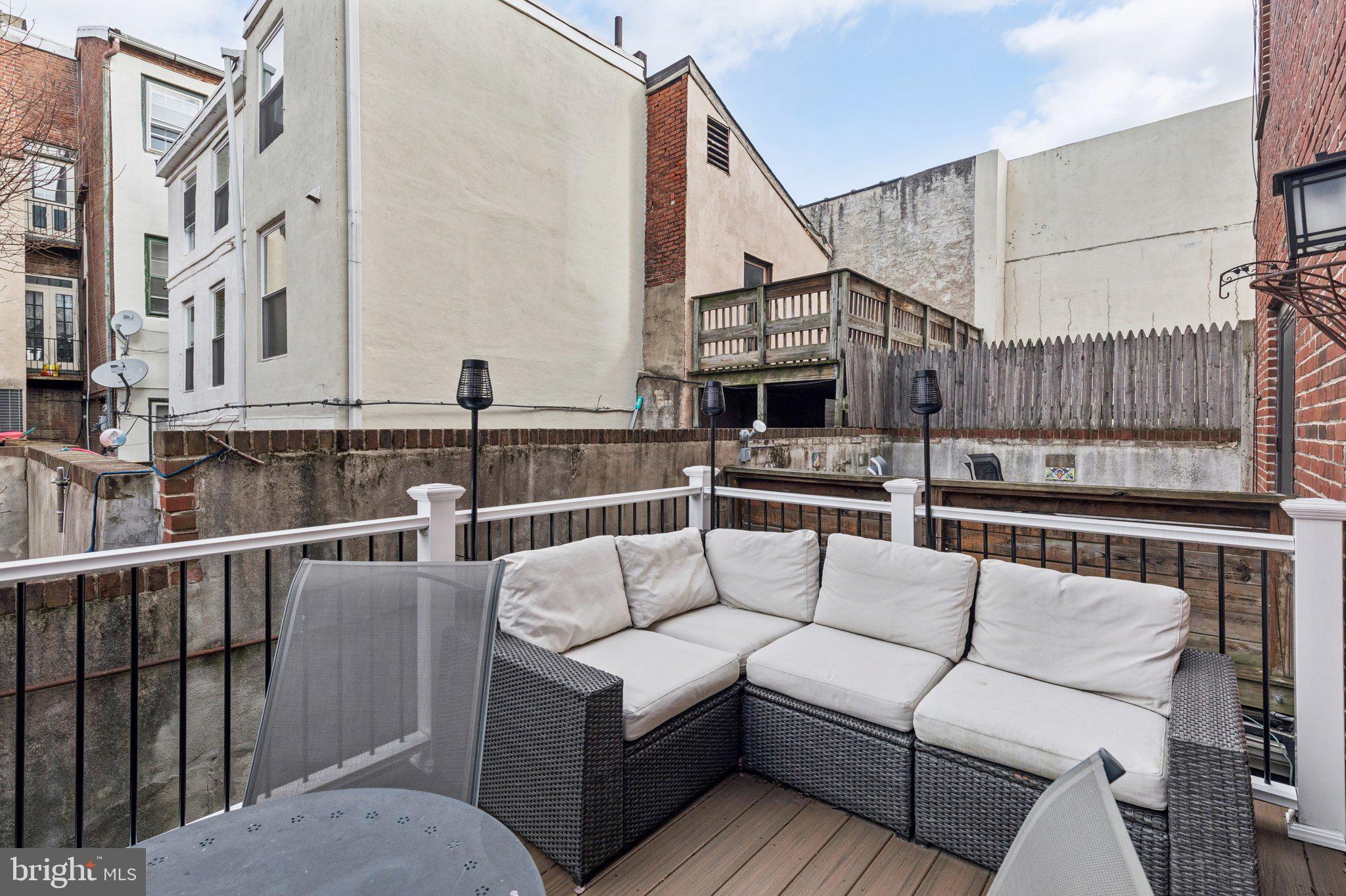 429 Gaskill Street Philadelphia, PA 19147 - Photo 29 of 63 a view of a roof deck with couches and potted plants