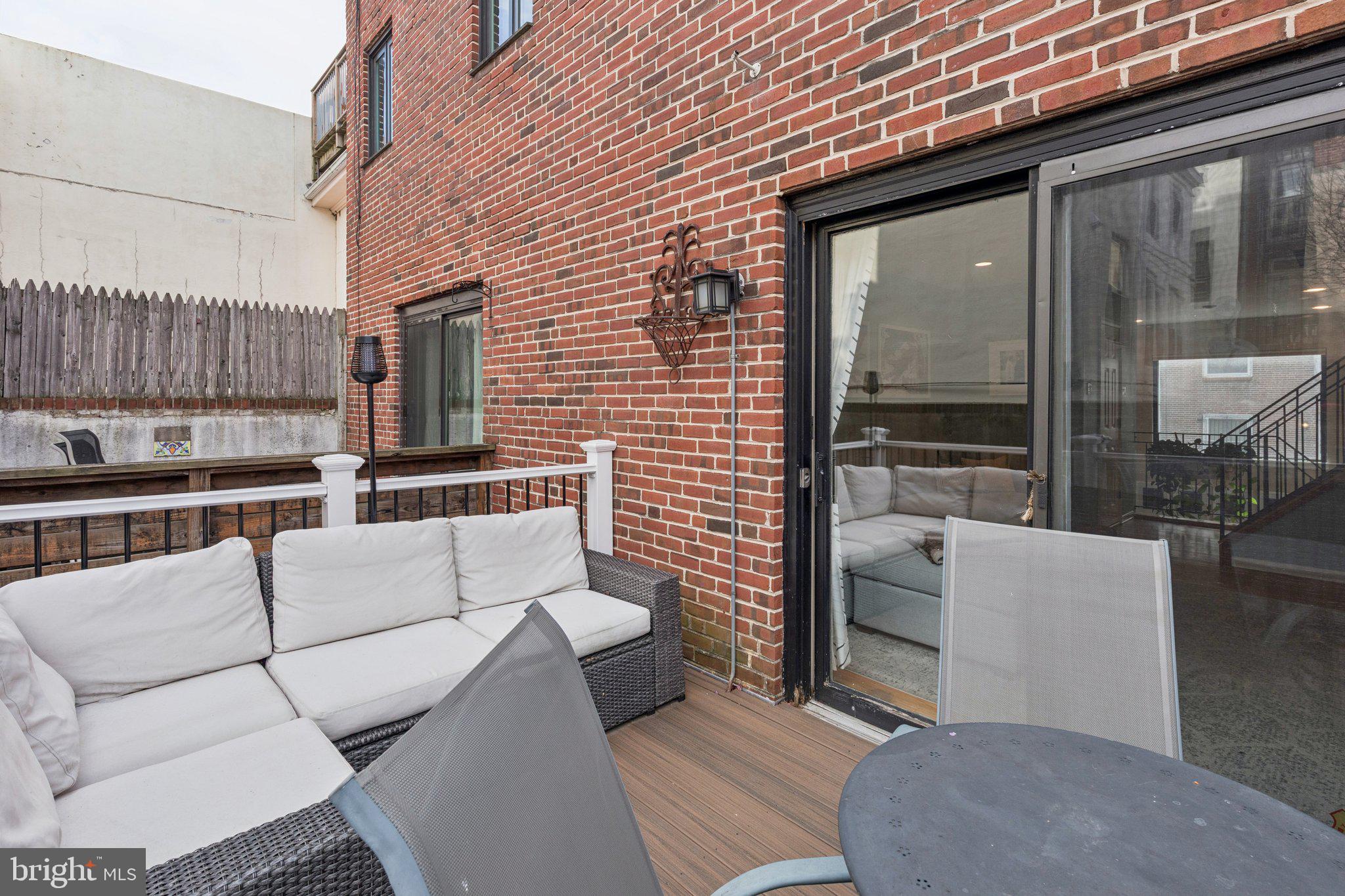 429 Gaskill Street Philadelphia, PA 19147 - Photo 30 of 63 a view of a patio with couches table and chairs