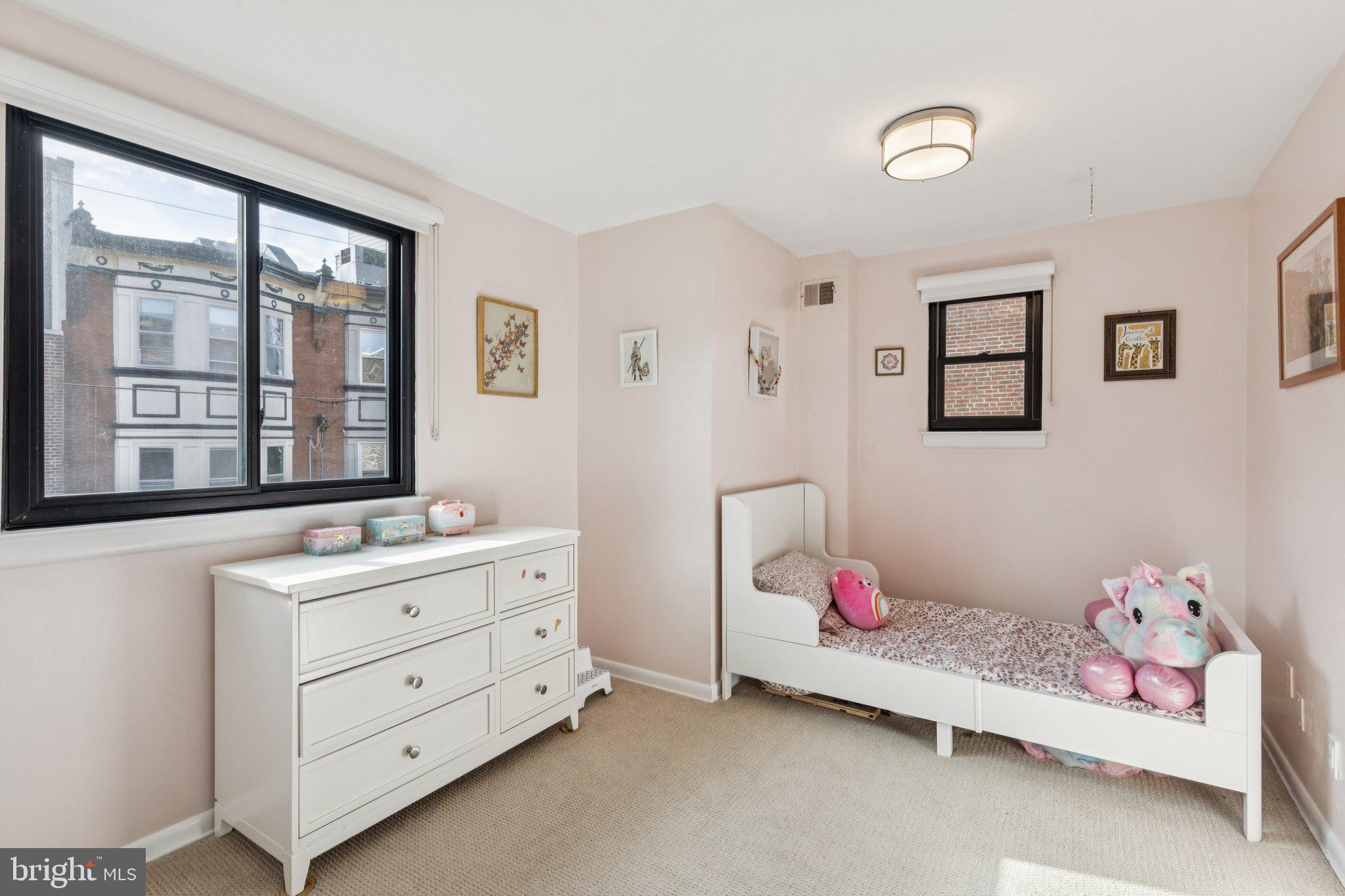 429 Gaskill Street Philadelphia, PA 19147 - Photo 39 of 63 a bedroom with a bed and window