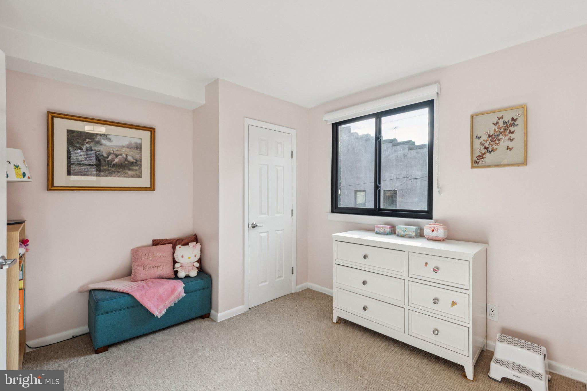 429 Gaskill Street Philadelphia, PA 19147 - Photo 41 of 63 a spacious bedroom with a bed and a window