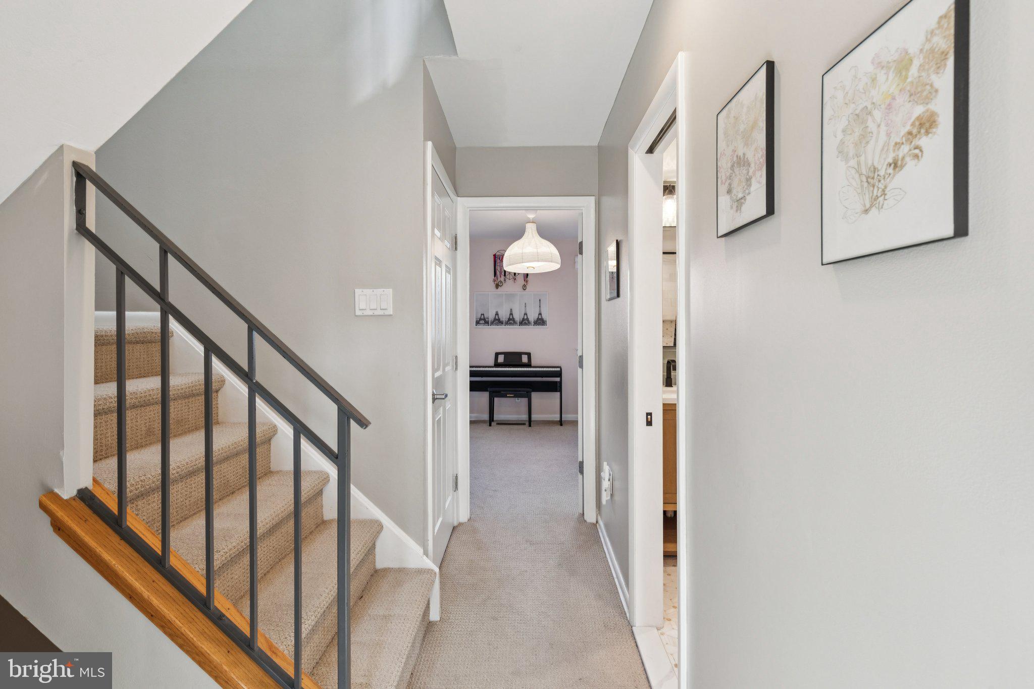 429 Gaskill Street Philadelphia, PA 19147 - Photo 42 of 63 a view of a hallway with wooden floor and staircase