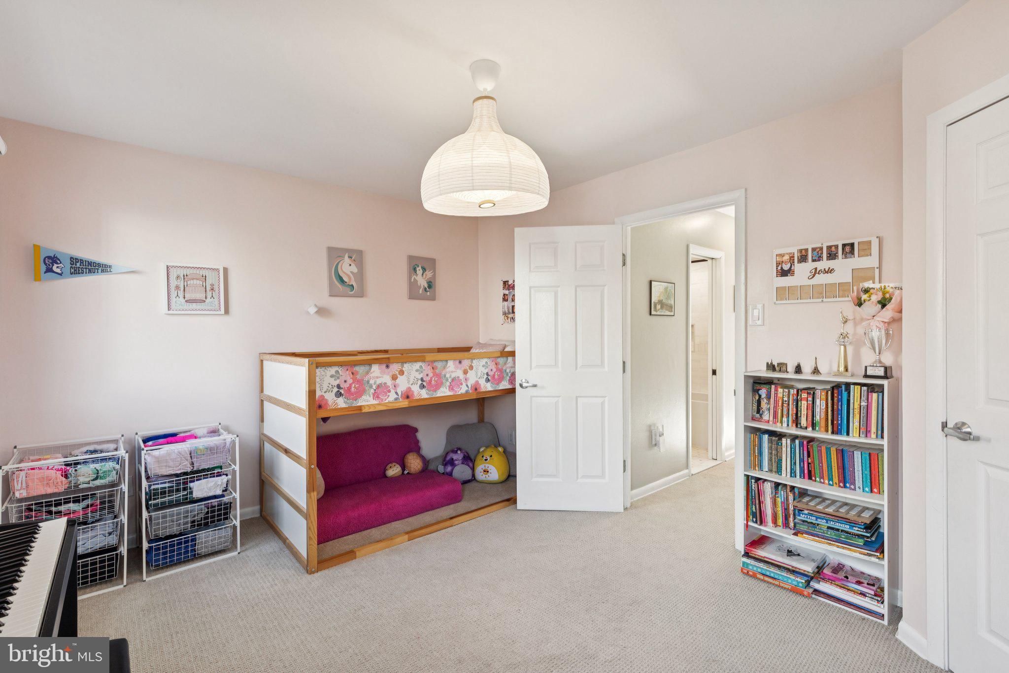 429 Gaskill Street Philadelphia, PA 19147 - Photo 48 of 63 a bedroom with furniture and a book shelf