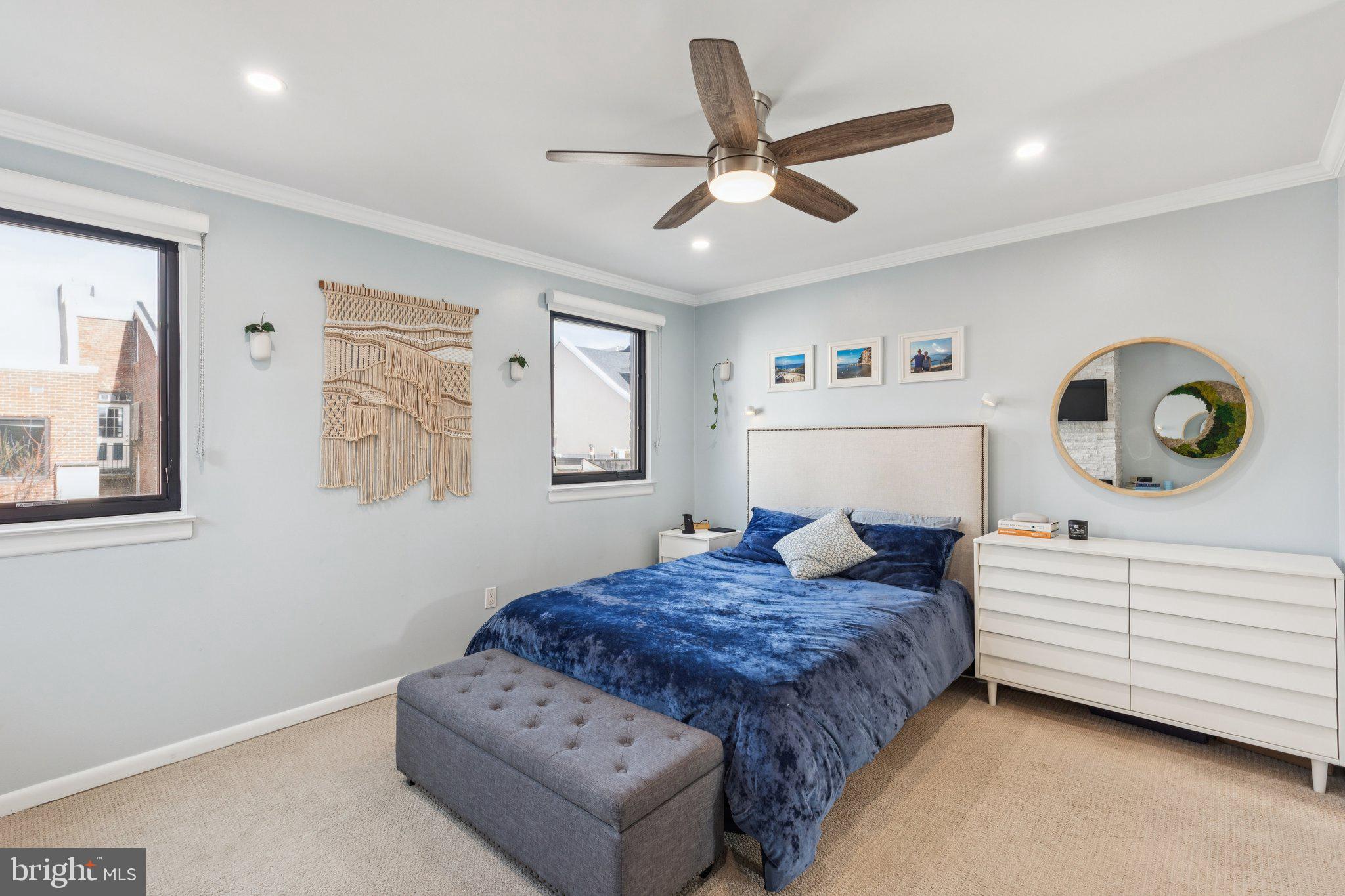 429 Gaskill Street Philadelphia, PA 19147 - Photo 51 of 63 a bedroom with a bed and a dresser