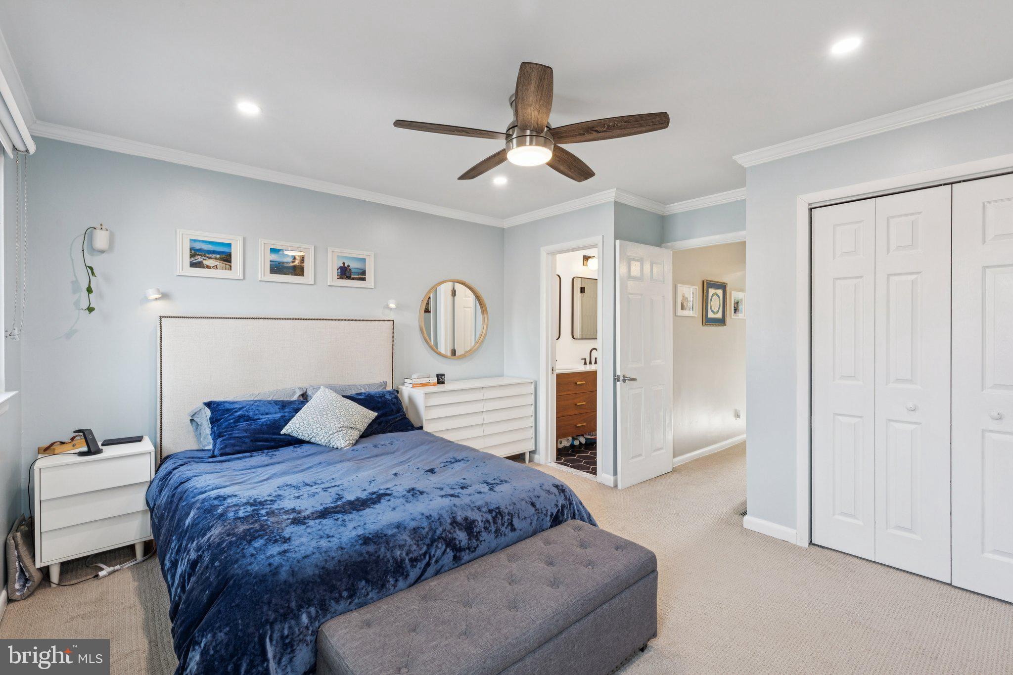 429 Gaskill Street Philadelphia, PA 19147 - Photo 52 of 63 a bedroom with a large bed and a chandelier