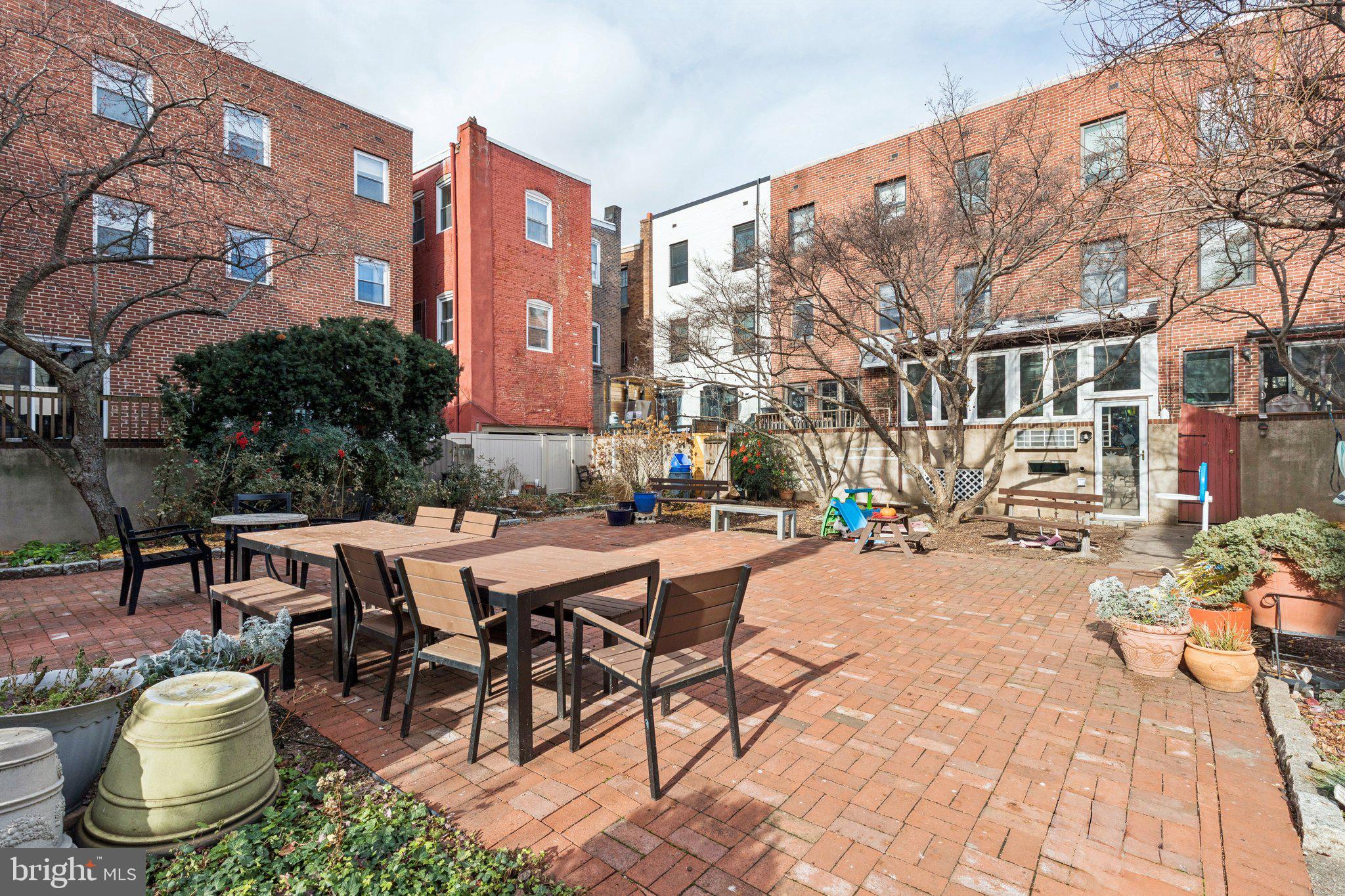 429 Gaskill Street Philadelphia, PA 19147 - Photo 57 of 63 a view of a patio with a table and chairs and potted plants