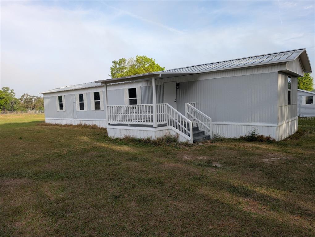 26103 County Road 44A Eustis, FL 32736 - Photo 1 of 1 a house with garden