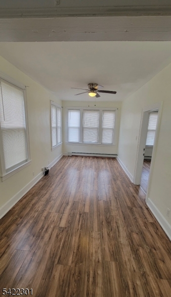 569 Morris Street Orange, NJ 07050 - Photo 1 of 10 a view of a room with wooden floors and window