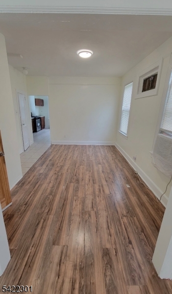 569 Morris Street Orange, NJ 07050 - Photo 2 of 10 a view of empty room with wooden floor