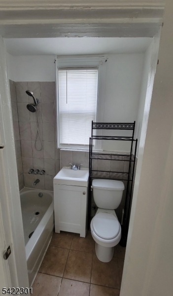 569 Morris Street Orange, NJ 07050 - Photo 10 of 10 a bathroom with a toilet sink and bathtub