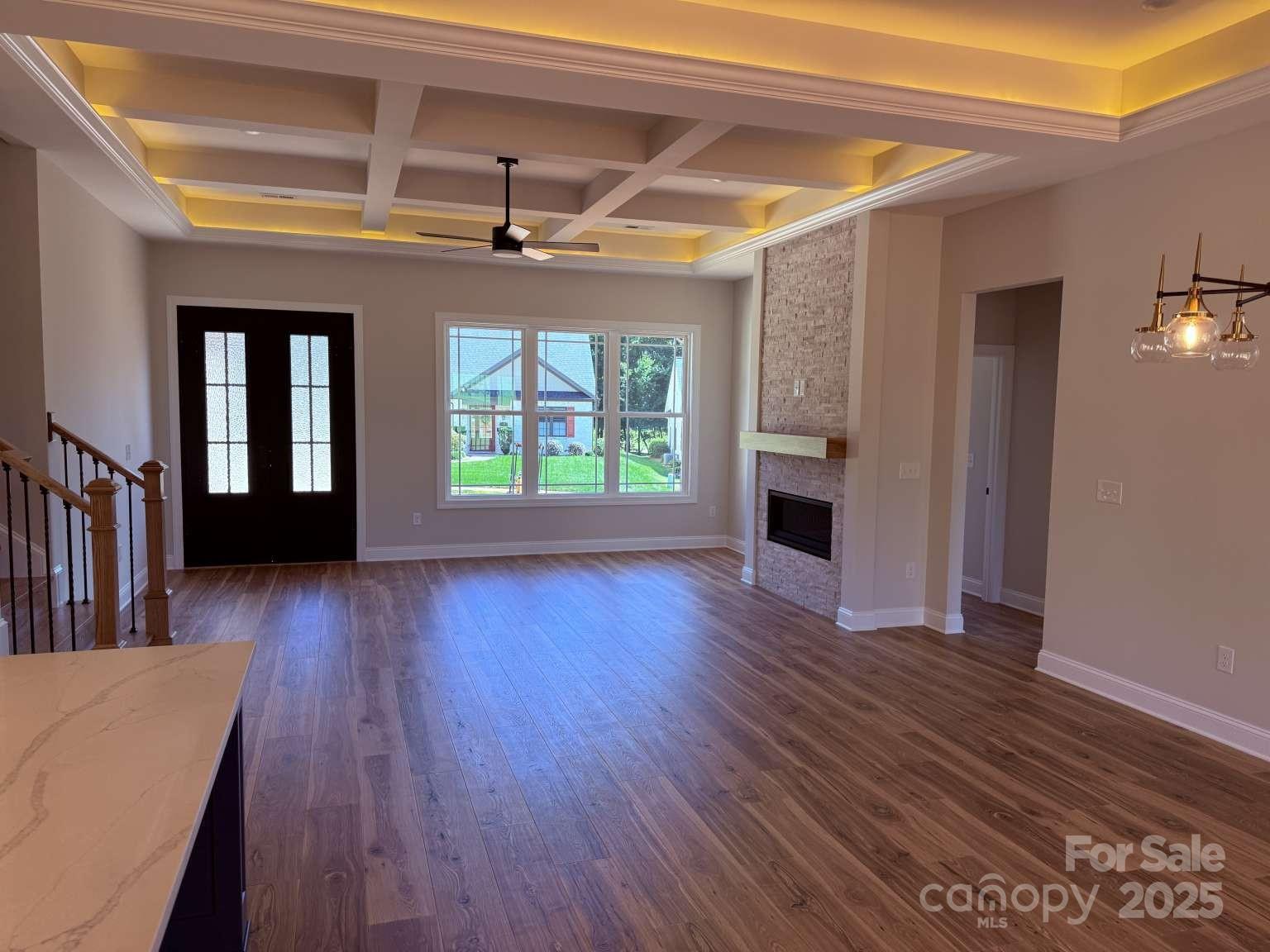 4173 Holly Circle Northeast Conover, NC 28613 - Photo 18 of 40 a view of a livingroom with wooden floor and a ceiling fan