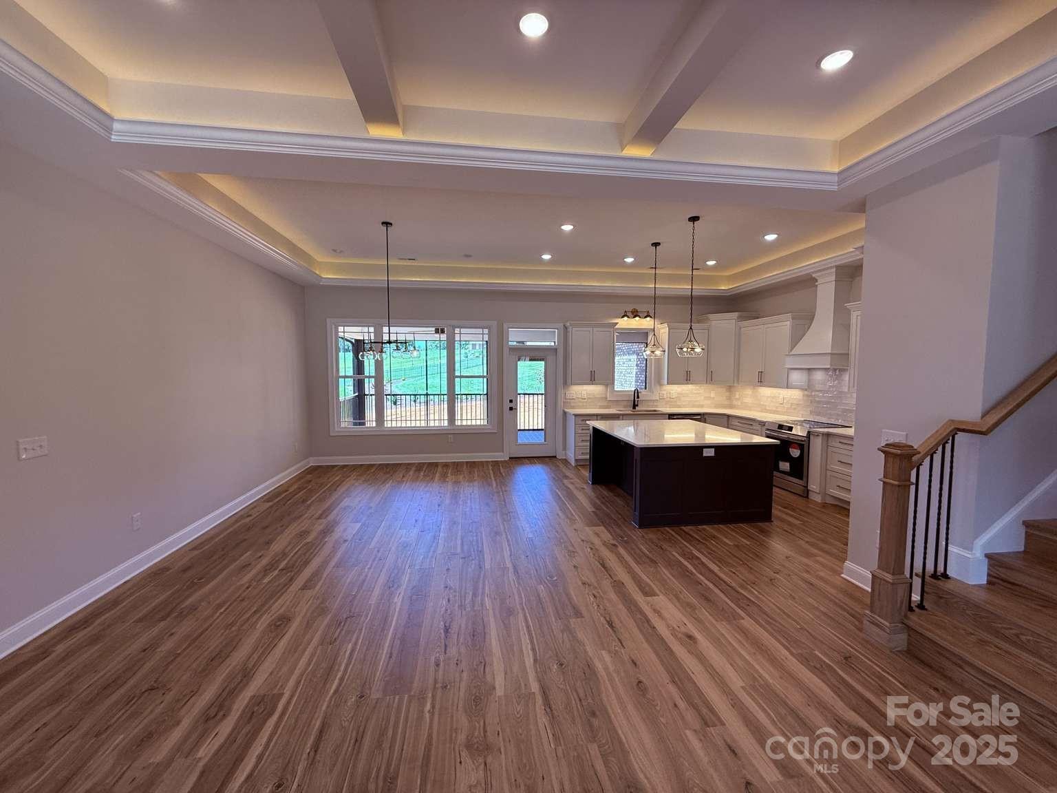 4173 Holly Circle Northeast Conover, NC 28613 - Photo 20 of 40 a large room with kitchen island a wooden floor and a sink