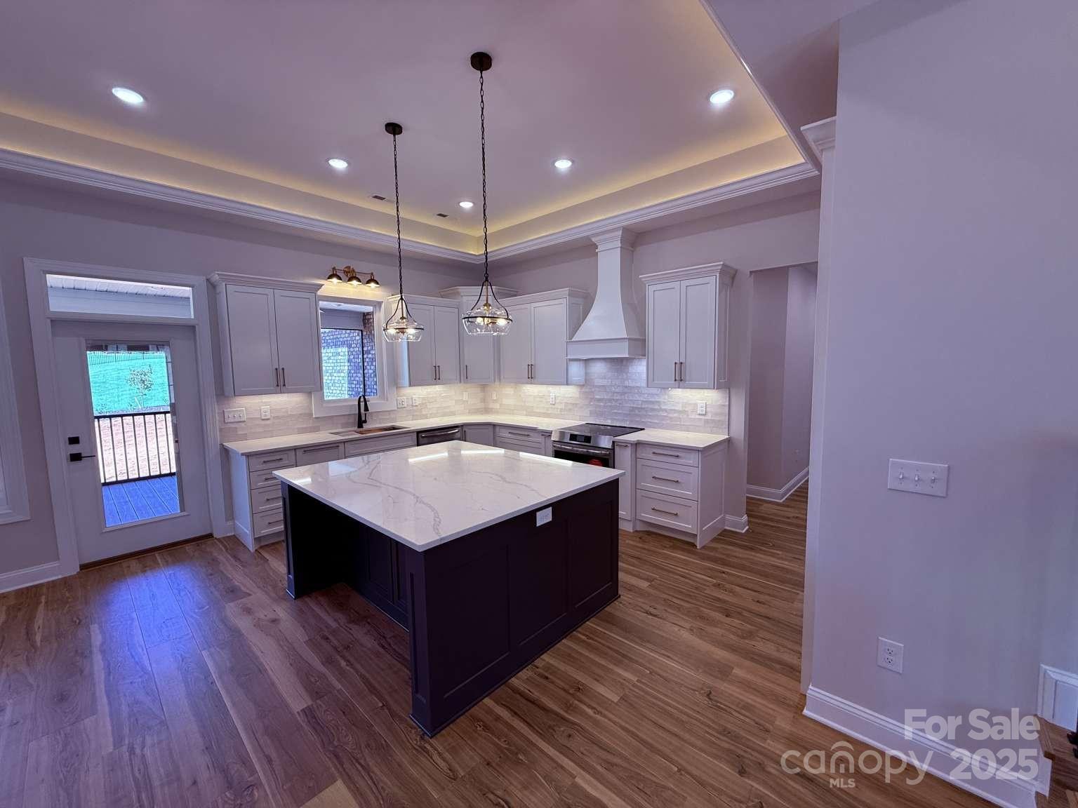4173 Holly Circle Northeast Conover, NC 28613 - Photo 6 of 40 a kitchen with a stove and a wooden floor