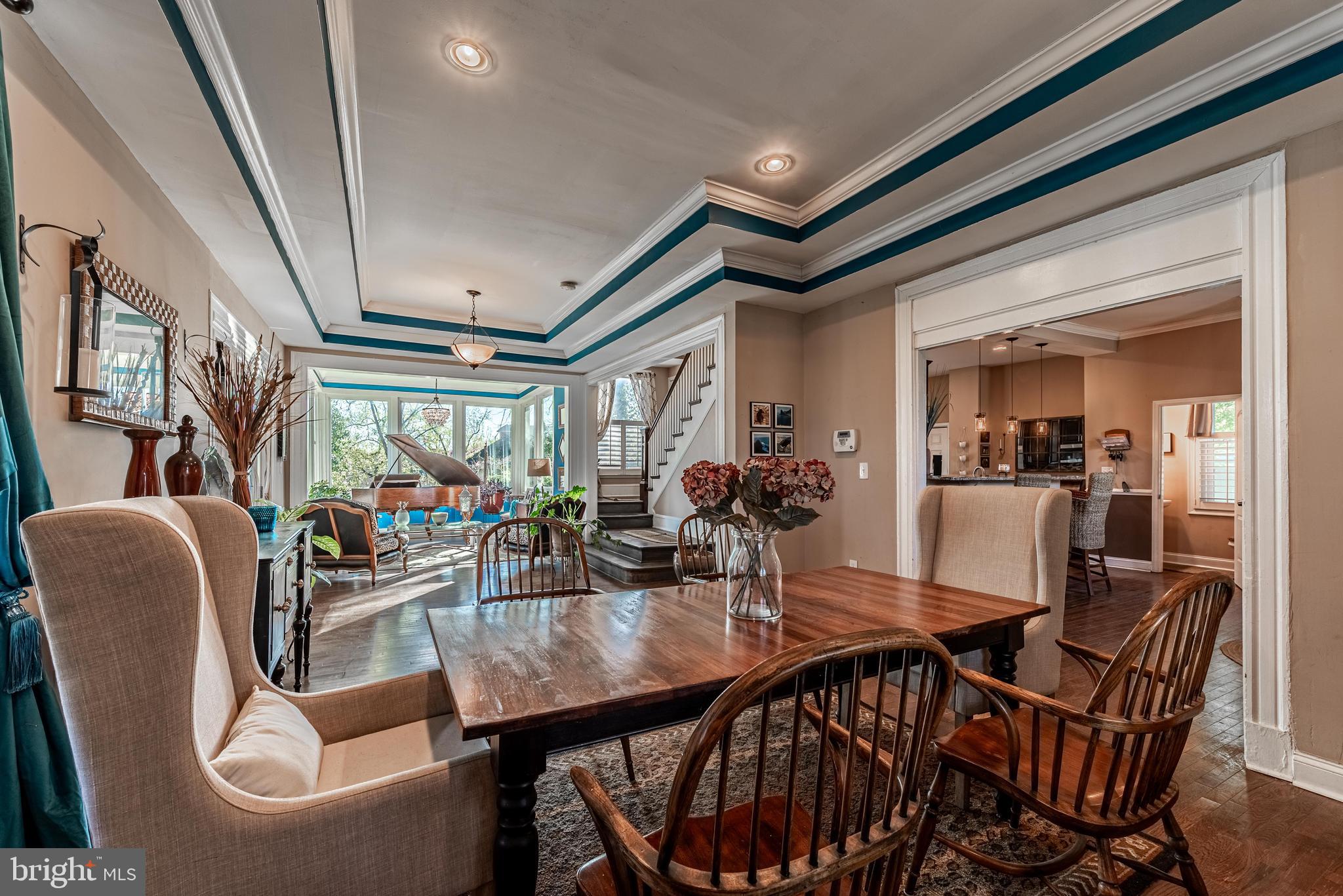 a dining room with furniture and window