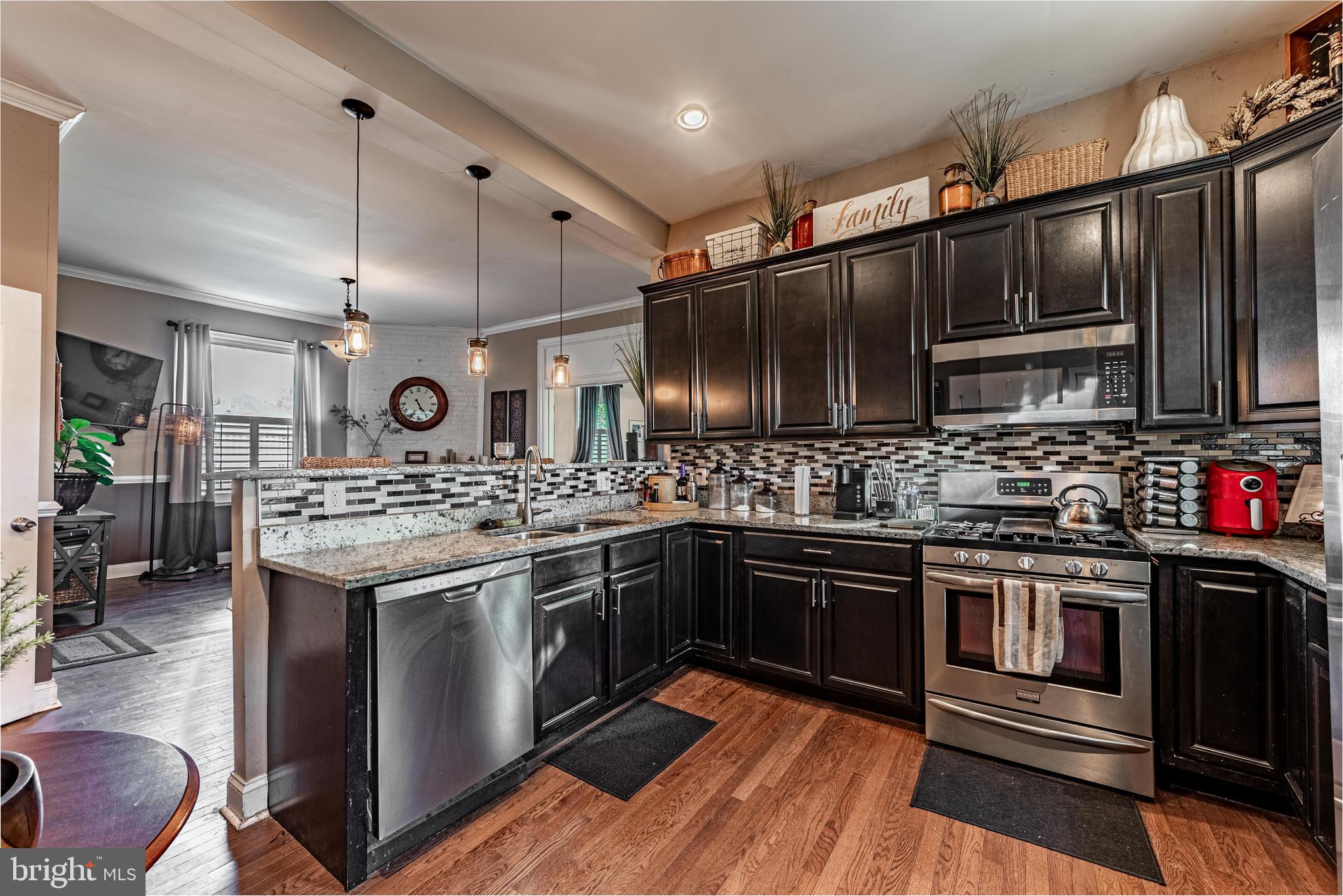 2600 Queen Anne Road Baltimore, MD 21216 - Photo 11 of 28 a kitchen with stainless steel appliances granite countertop a stove and a sink
