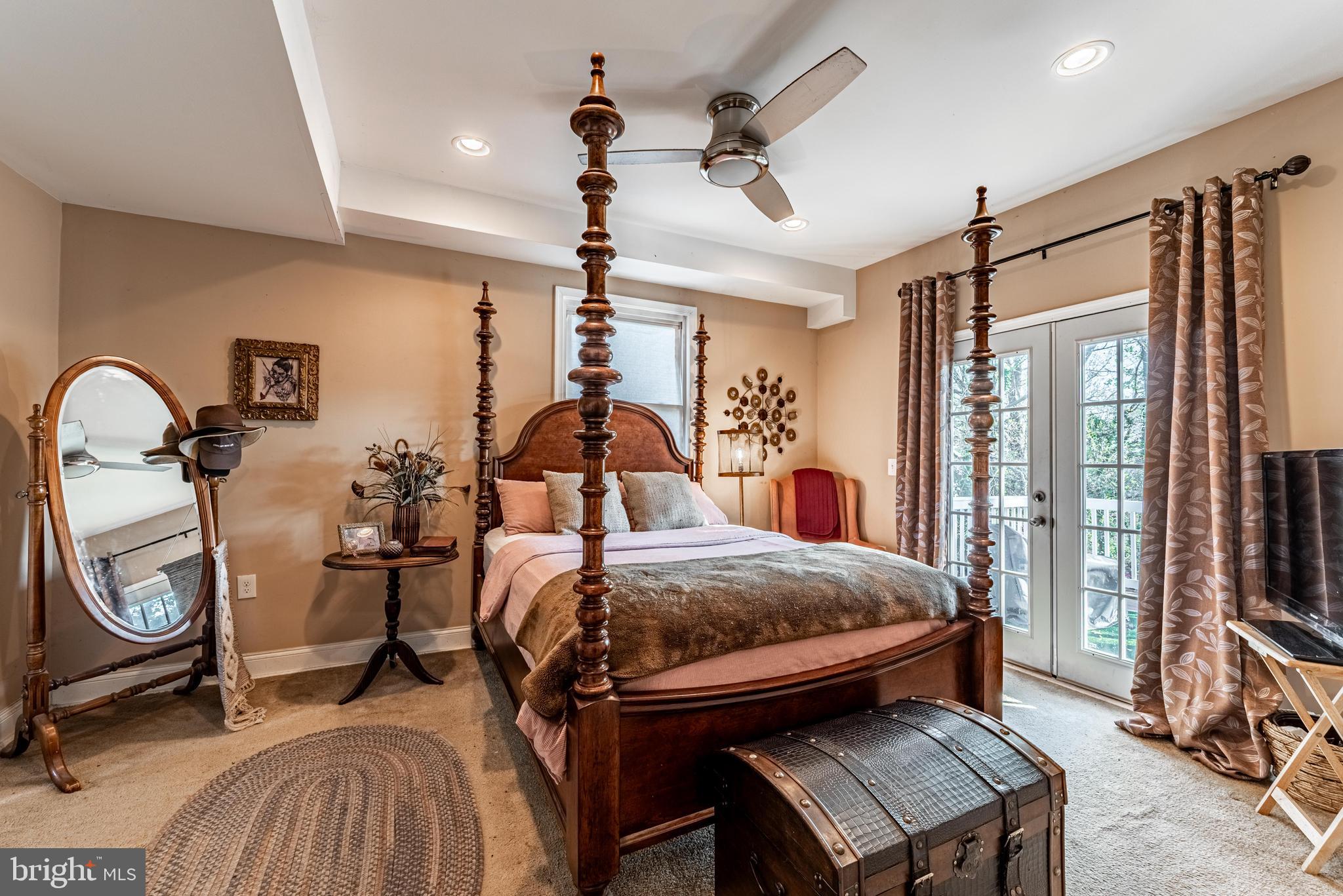 2600 Queen Anne Road Baltimore, MD 21216 - Photo 15 of 28 a bedroom with bed and wooden floor