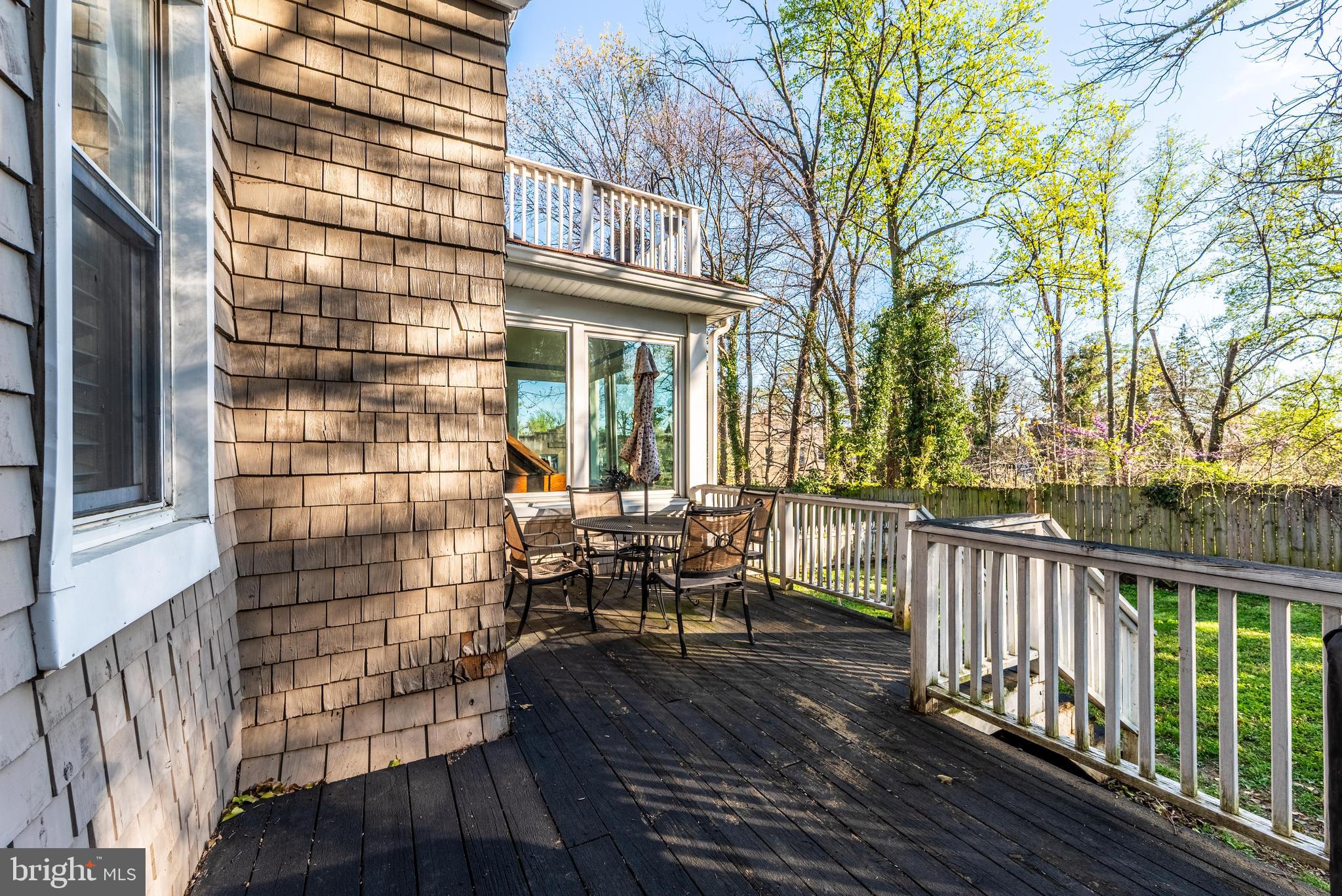 2600 Queen Anne Road Baltimore, MD 21216 - Photo 25 of 28 a balcony with wooden floor and furniture