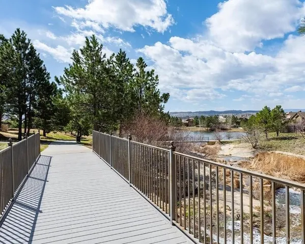 a view of a balcony with wooden floor