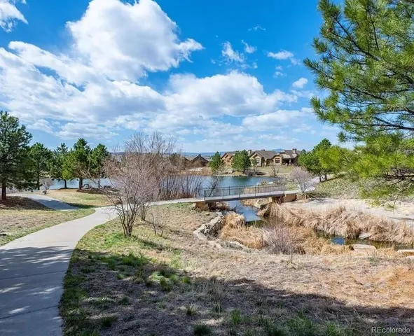 a view of a lake view with houses in back