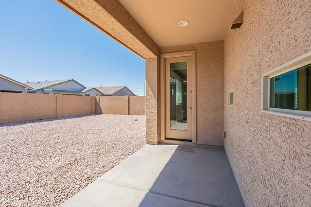 a front view of house with a garden