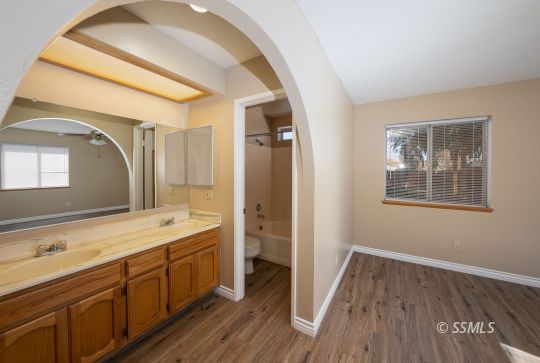 336 North Kern Street Ridgecrest, CA 93555 - Photo 20 of 35 a spacious bathroom with a double vanity sink and a mirror