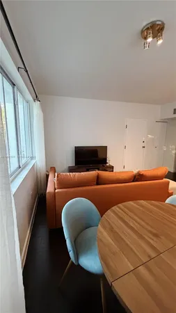 a bedroom with two beds and a window