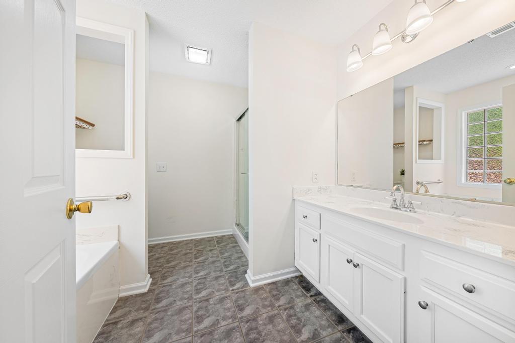 848 Perkins Creek Road Seneca, SC 29678 - Photo 16 of 26 This bright bathroom features a spacious vanity with ample counter space and a modern shower enclosure.