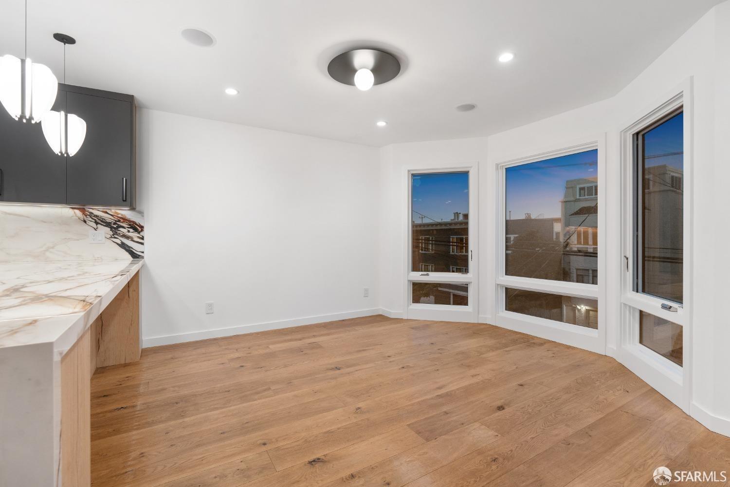 174-172 18th Avenue, Unit 172 San Francisco, CA 94121 - Photo 12 of 37 a view of a kitchen with a sink and a large window