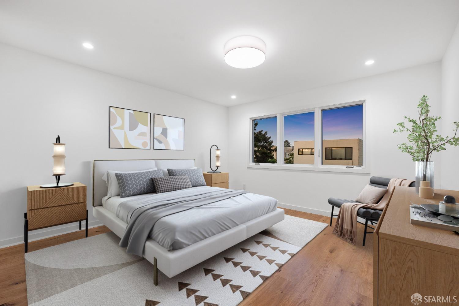 174-172 18th Avenue, Unit 172 San Francisco, CA 94121 - Photo 15 of 37 a bedroom with a large bed and a couch