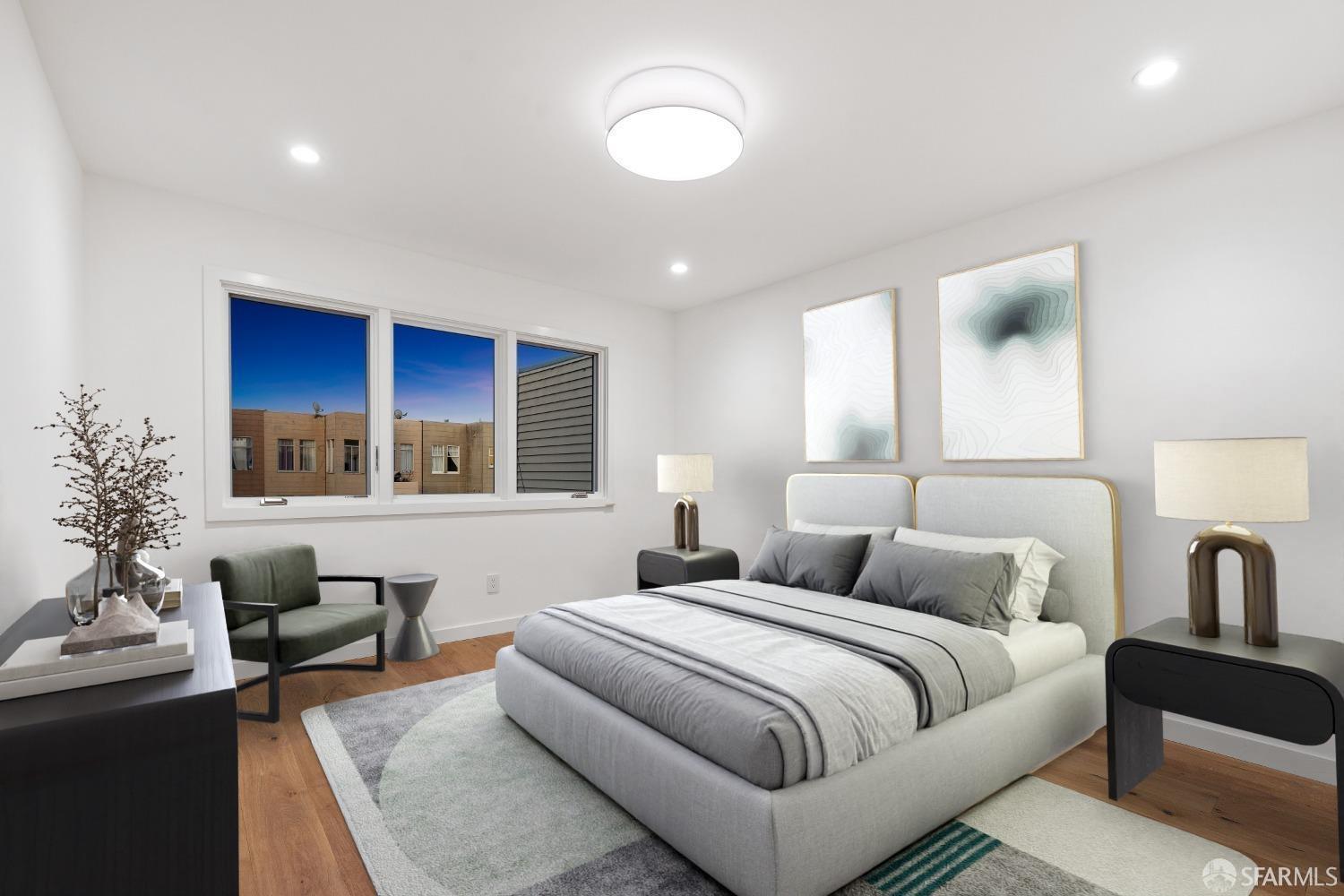 174-172 18th Avenue, Unit 172 San Francisco, CA 94121 - Photo 16 of 37 a bedroom with furniture and a large window