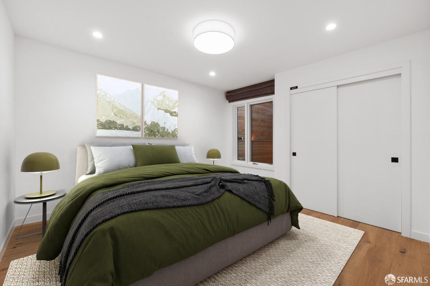 174-172 18th Avenue, Unit 172 San Francisco, CA 94121 - Photo 17 of 37 a bed sitting in a bedroom next to a window