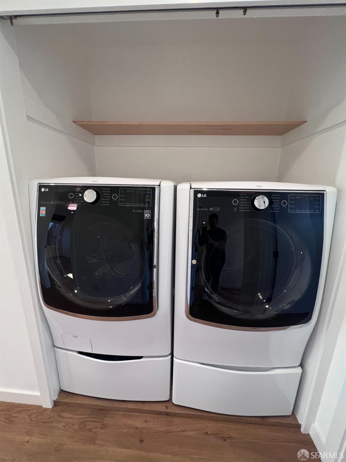 174-172 18th Avenue, Unit 172 San Francisco, CA 94121 - Photo 23 of 37 a bathroom with a mirror and toilet