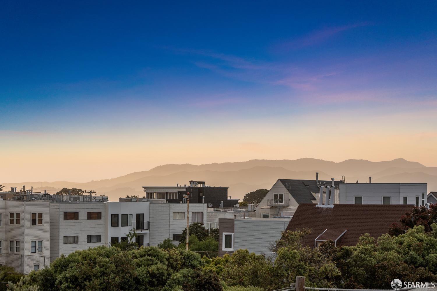174-172 18th Avenue, Unit 172 San Francisco, CA 94121 - Photo 27 of 37 an aerial view of residential houses with outdoor space and street view