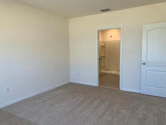 a bathroom with a granite countertop sink toilet a mirror and bathtub