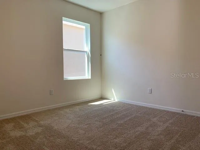 an empty room with closet area