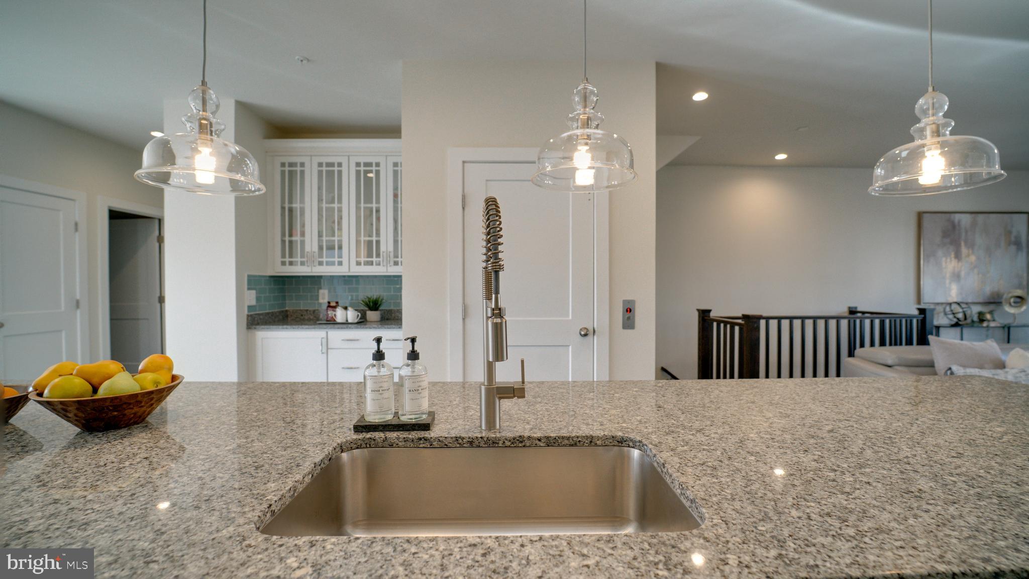 20062 Old Line Terrace Ashburn, VA 20147 - Photo 14 of 79 a kitchen with stainless steel appliances granite countertop a sink a stove and a granite counter top