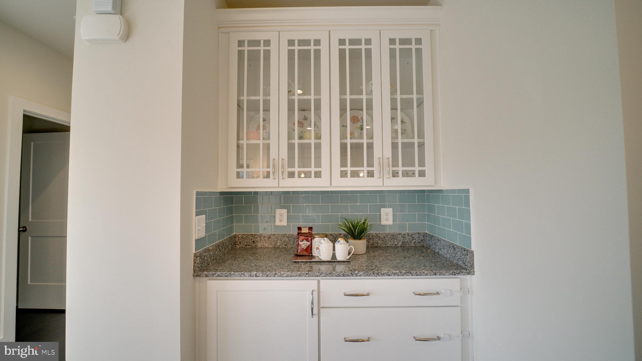 20062 Old Line Terrace Ashburn, VA 20147 - Photo 15 of 79 a kitchen with stainless steel appliances granite countertop white cabinets and a potted plant