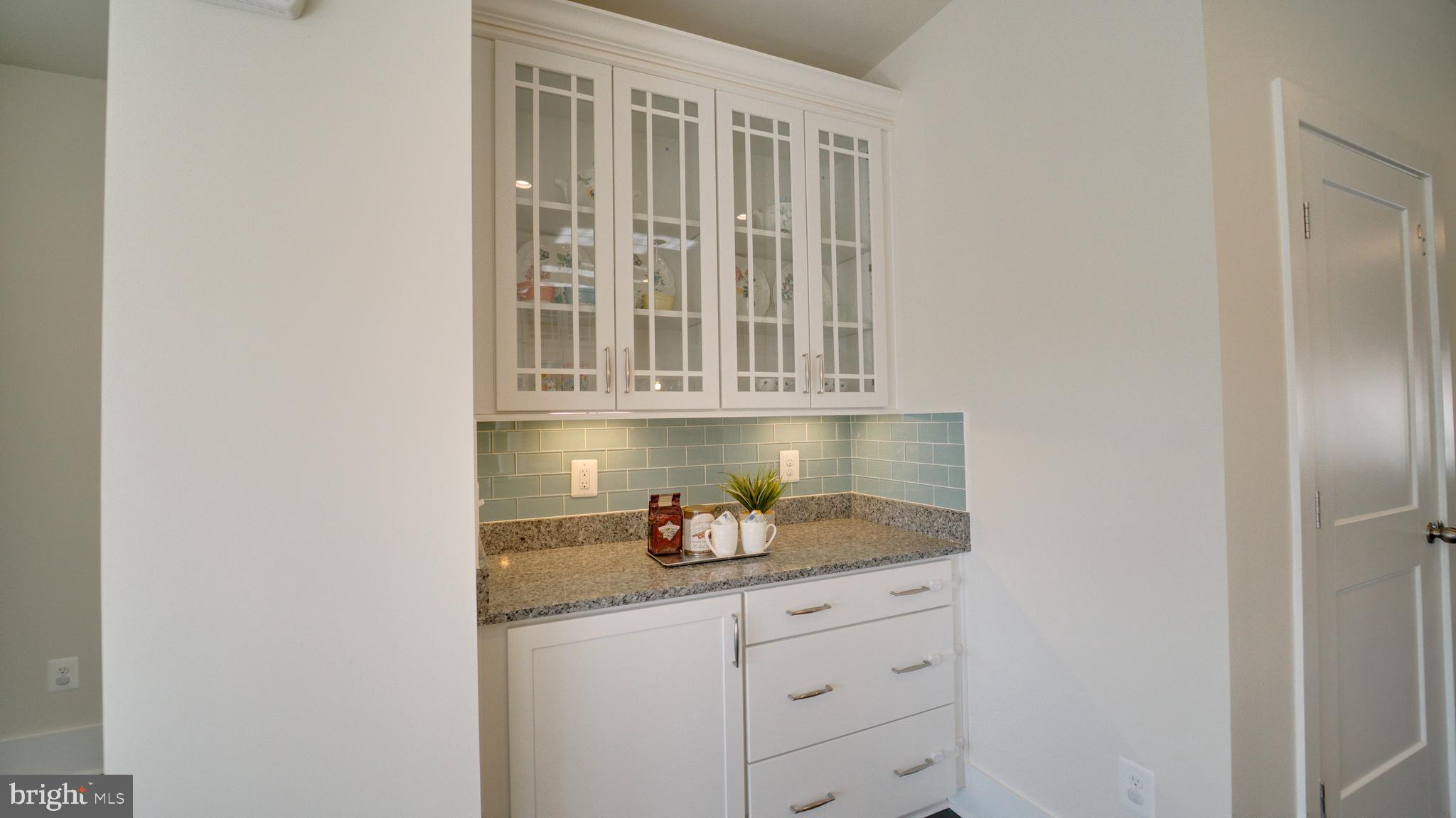 20062 Old Line Terrace Ashburn, VA 20147 - Photo 16 of 79 a kitchen with granite countertop white cabinets and stainless steel appliances