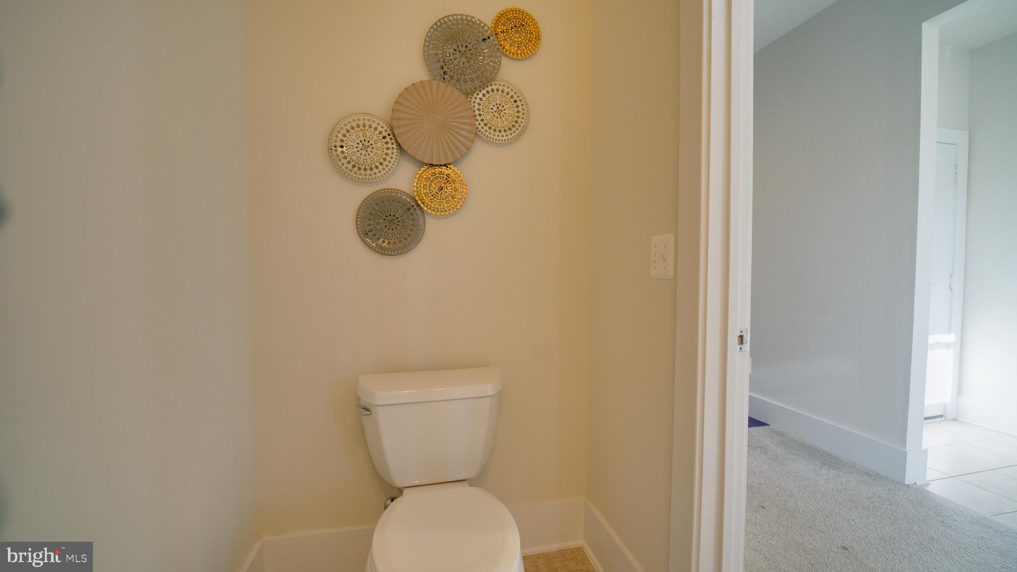 20062 Old Line Terrace Ashburn, VA 20147 - Photo 30 of 79 a bathroom with a toilet and a window