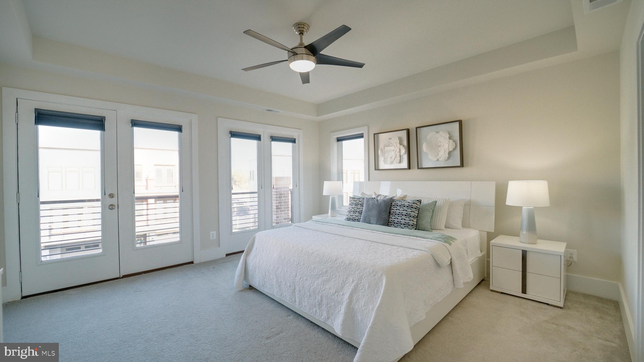 20062 Old Line Terrace Ashburn, VA 20147 - Photo 35 of 79 a bedroom with a large bed and a large window