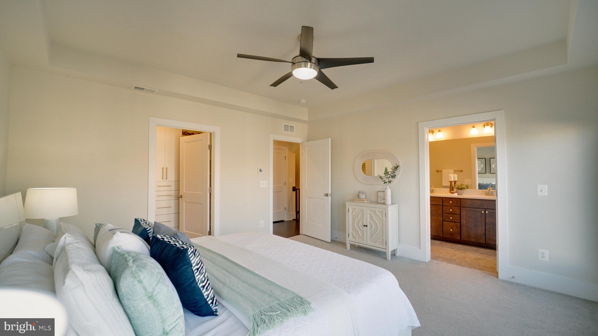 20062 Old Line Terrace Ashburn, VA 20147 - Photo 36 of 79 a bedroom with a bed and a walk in closet