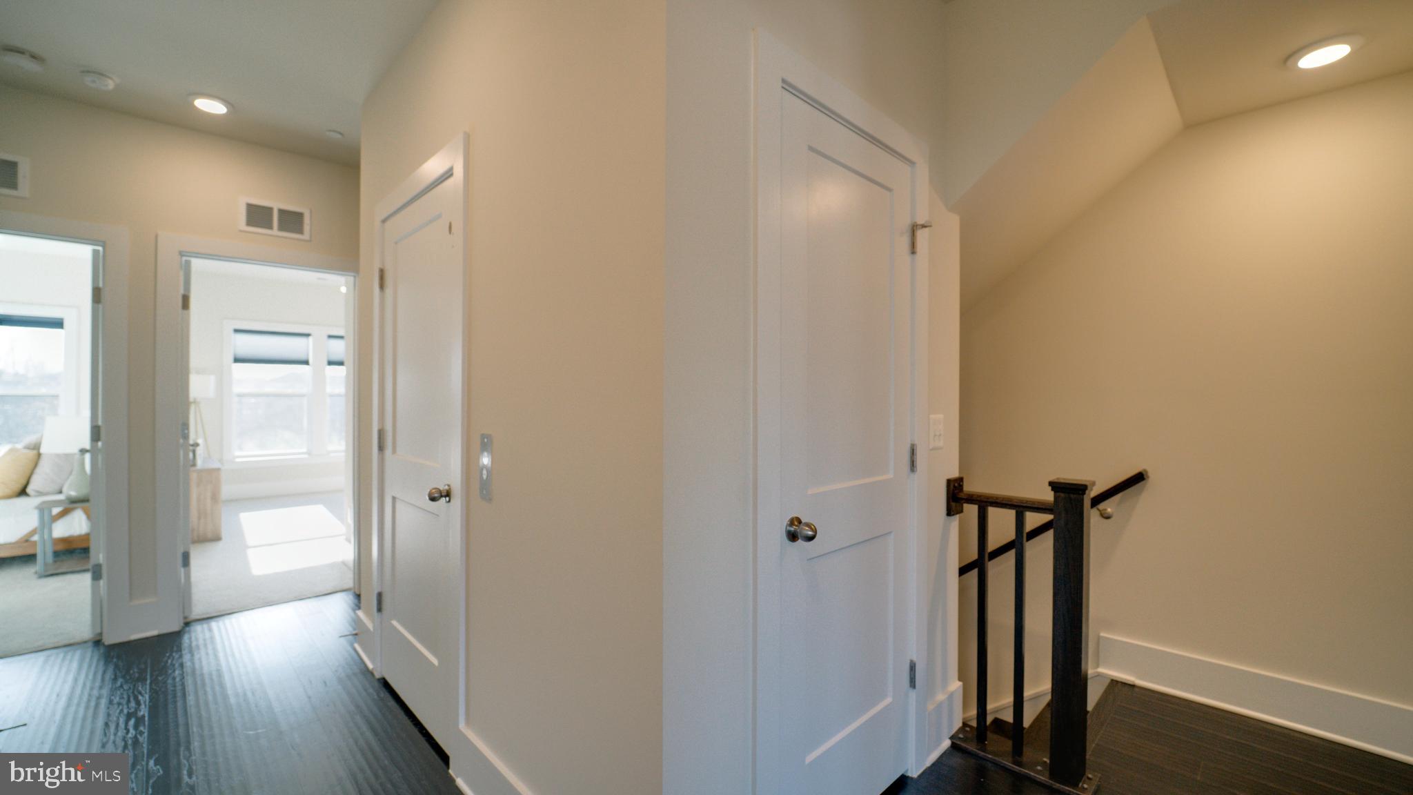 20062 Old Line Terrace Ashburn, VA 20147 - Photo 43 of 79 a view of a hallway with wooden floor