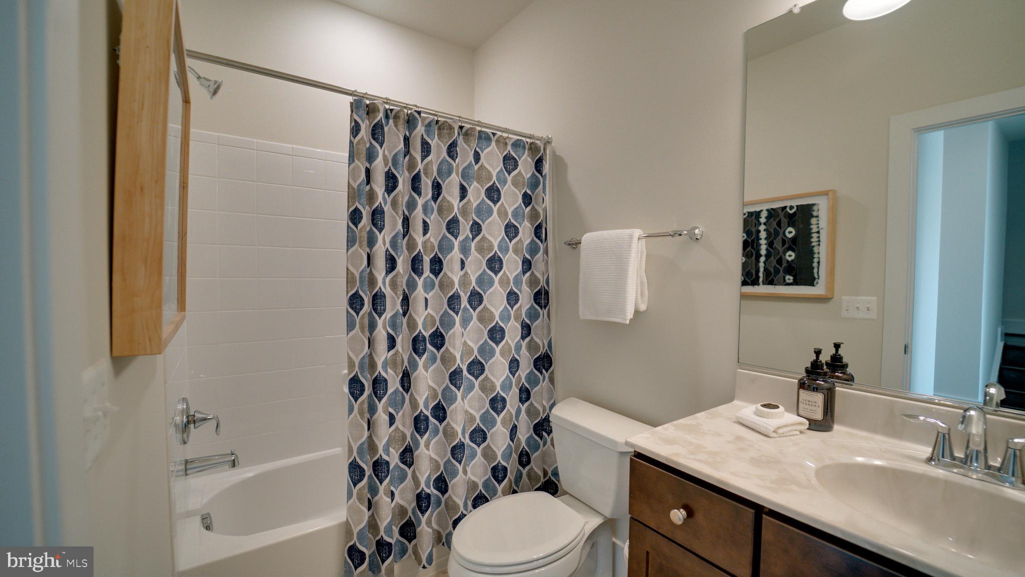 20062 Old Line Terrace Ashburn, VA 20147 - Photo 45 of 79 a bathroom with a sink toilet and shower