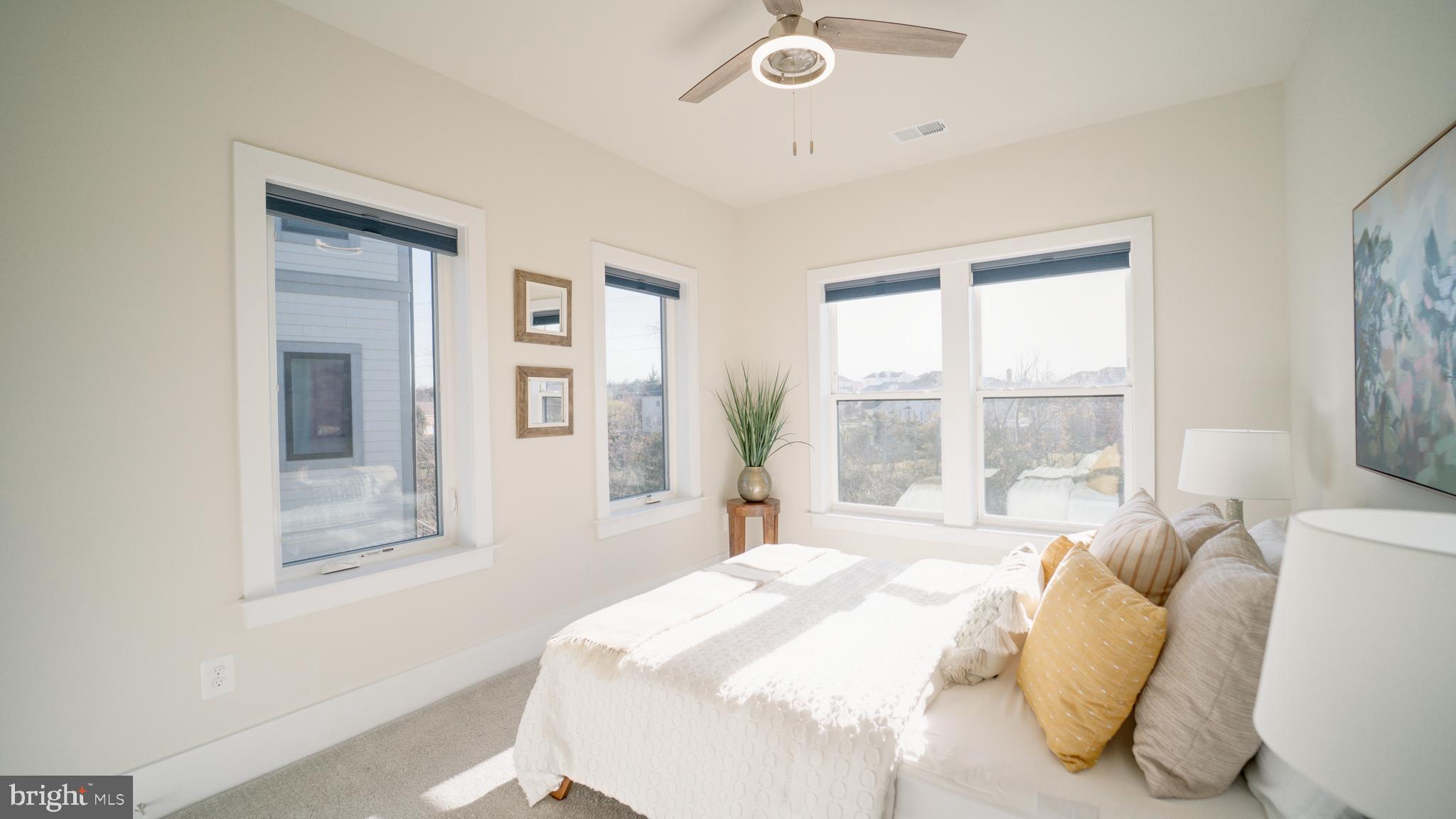 20062 Old Line Terrace Ashburn, VA 20147 - Photo 47 of 79 a bedroom with a bed and a large window