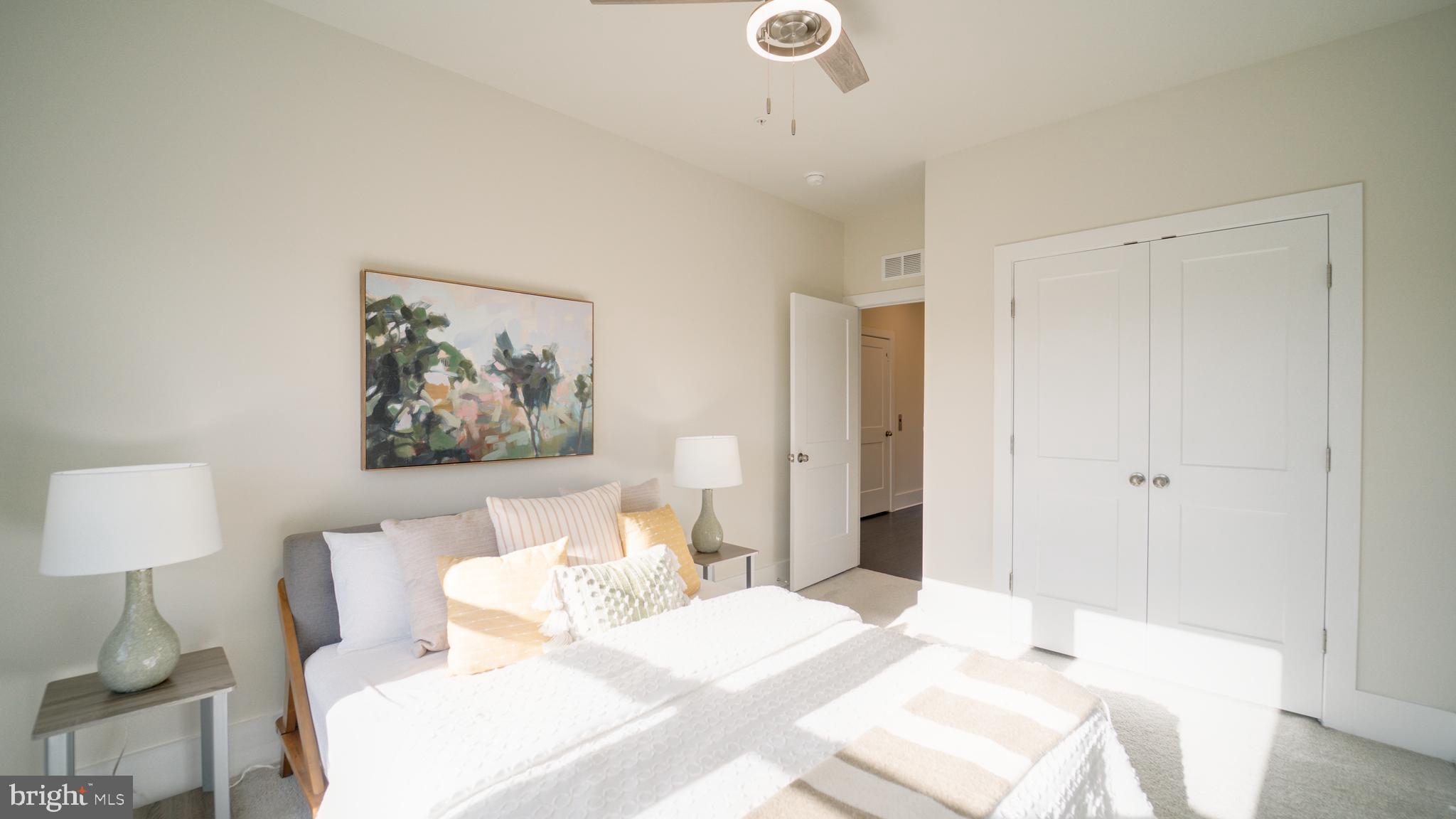 20062 Old Line Terrace Ashburn, VA 20147 - Photo 48 of 79 a bedroom with a bed and a painting on the wall