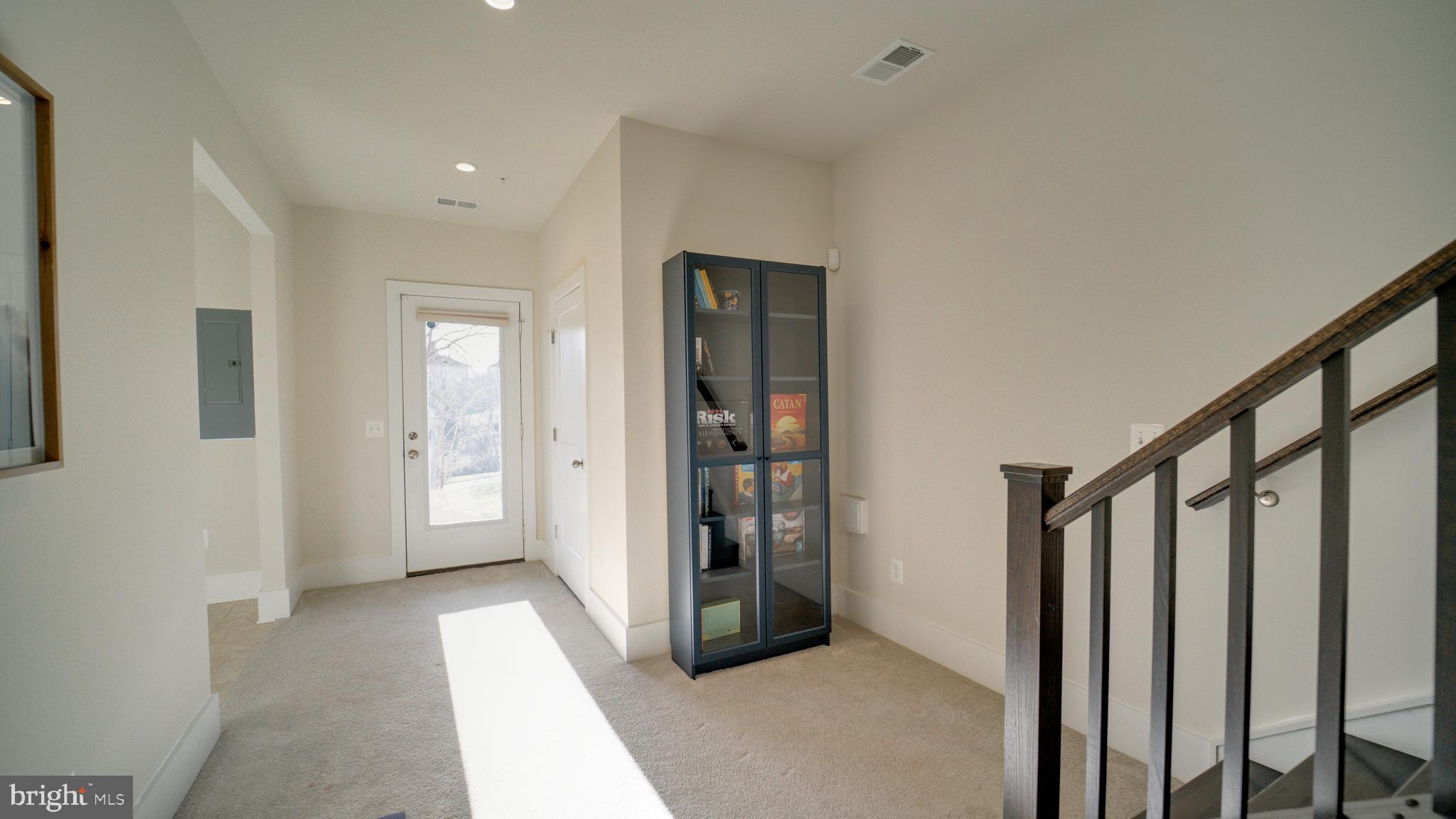 20062 Old Line Terrace Ashburn, VA 20147 - Photo 5 of 79 a view of a hallway with wooden floor and entryway