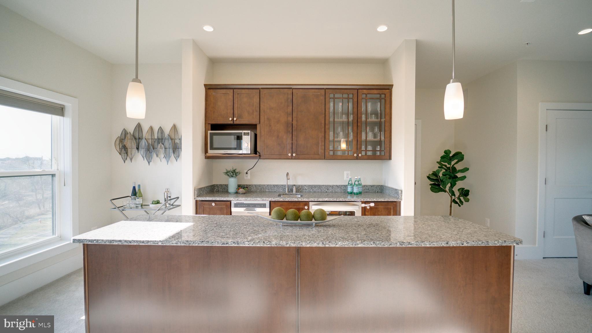20062 Old Line Terrace Ashburn, VA 20147 - Photo 59 of 79 a kitchen with a refrigerator a sink and a stove